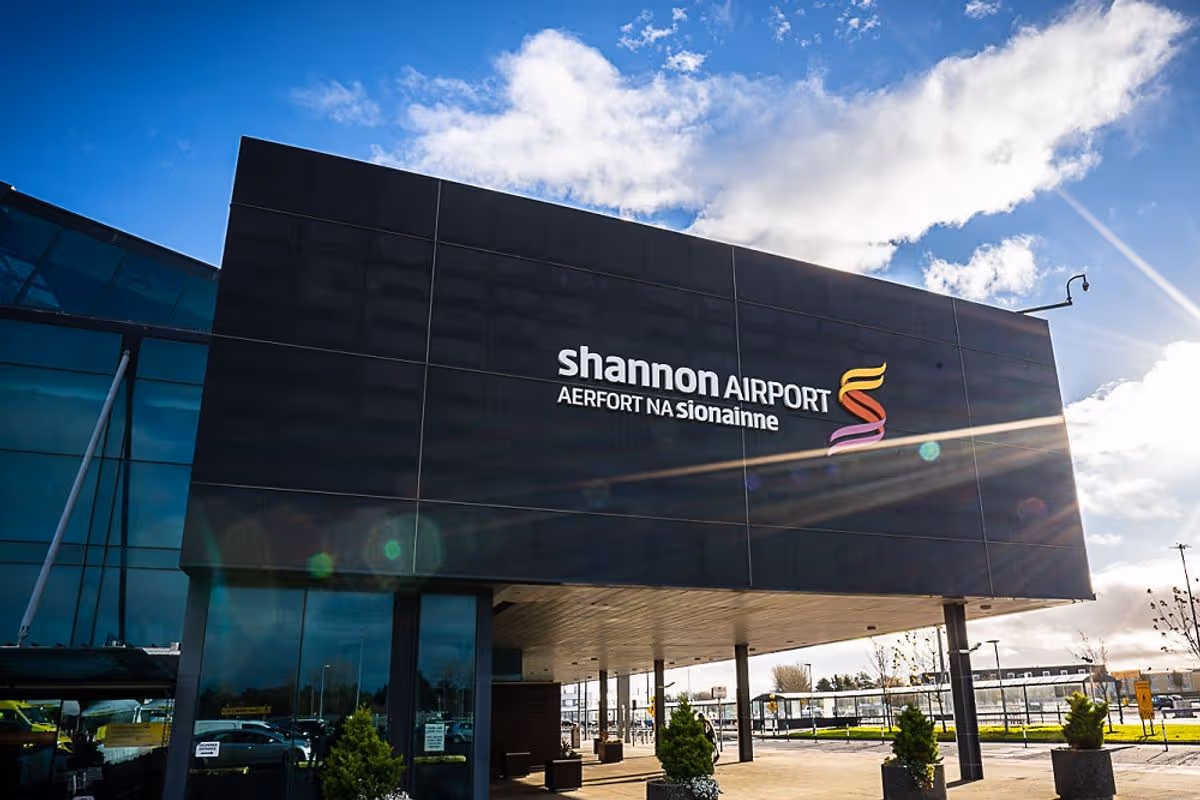 A view of the exterior of Shannon Airport against a sunny blue sky. 