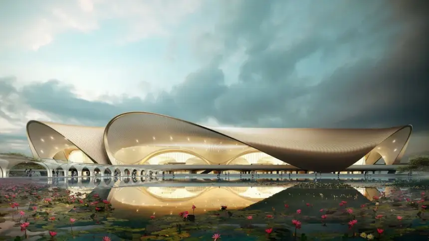 Architectural rendering of Navi Mumbai International Airport's terminal building with a lotus pond in the foreground.