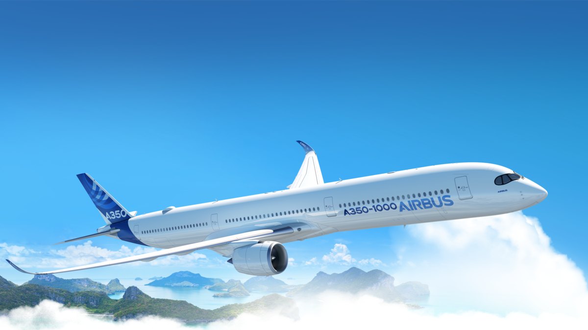 Airbus A350-1000 flying through the clouds against a blue sky, whole aircraft pictured side on view