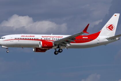 Air Algérie Boeing 737 MAX 8, registered D-AVOL, in flight against a cloudy sky.