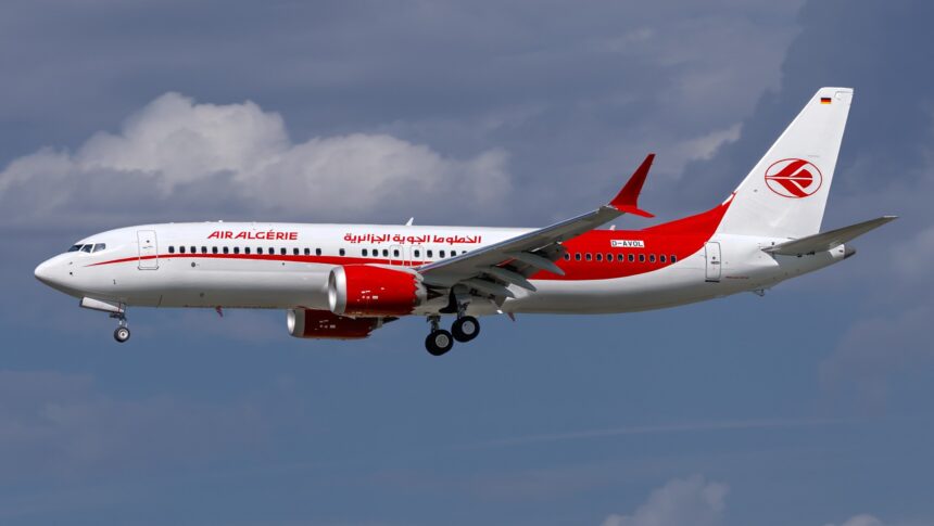 Air Algérie Boeing 737 MAX 8, registered D-AVOL, in flight against a cloudy sky.
