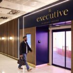 The new Manchester Airport lounges in Terminal 2. A man with a briefcase seen walking into the lounge entrance.
