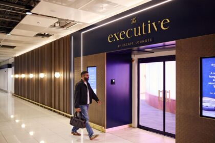 The new Manchester Airport lounges in Terminal 2. A man with a briefcase seen walking into the lounge entrance.