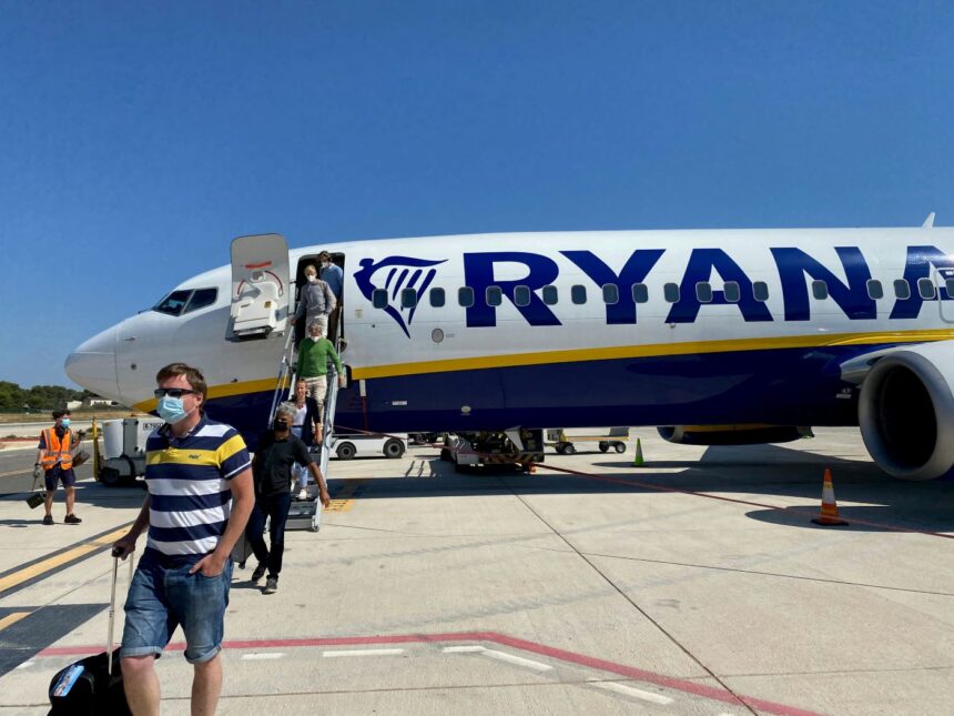 Ryanair jet landed on Mallorca tarmac with travelelrs leaving the plane and headed to the airport.