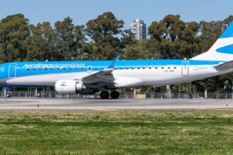 Aerolíneas Argentinas Embraer ERJ aircraft, registration LV-CDZ, taxiing on runway.