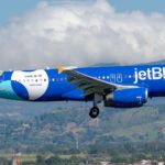 JetBlue Airbus A320-232 registered N506JB in special livery on approach with mountains in the background