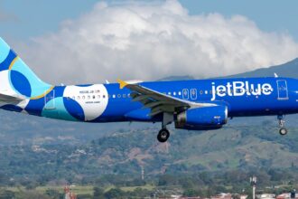 JetBlue Airbus A320-232 registered N506JB in special livery on approach with mountains in the background