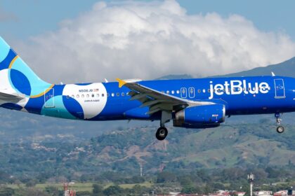 JetBlue Airbus A320-232 registered N506JB in special livery on approach with mountains in the background
