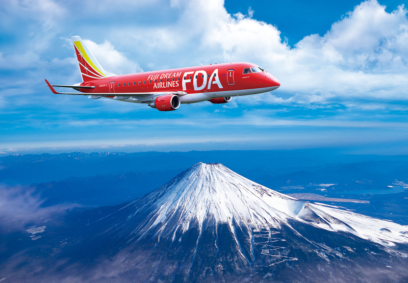 An image of a FDA e-jet flying over a snowy montain top.