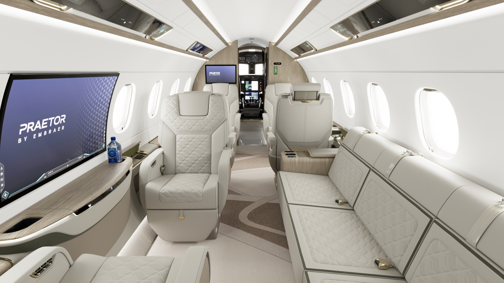 the inside of an Embraer executive jet with white interior and creme coloured seats. A TV shows 'Praetor by Embraer'