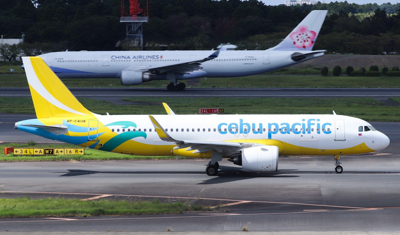 Cebu Pacific Airbus A320, registration RP-C4138, taxiing with a China Airlines aircraft in the background.