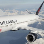 Exterior view of Air Canada aircraft cruising above the clouds.