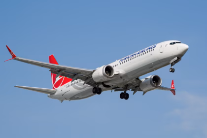 A Boeing 737 Max 9 flying on blue sky, the new moving assembly line replicates Boeing's existing 737 production system used at its Renton factory