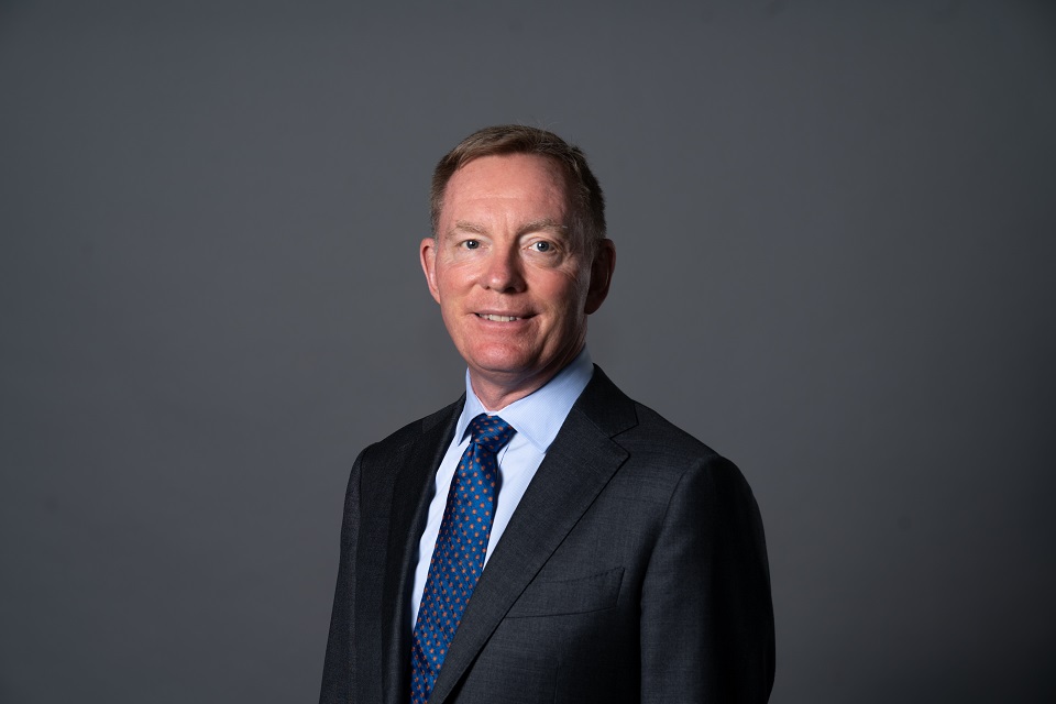 Chris Bryant, Minister for Space 2024-2025. A person wearing a suit standing in front of a grey background.