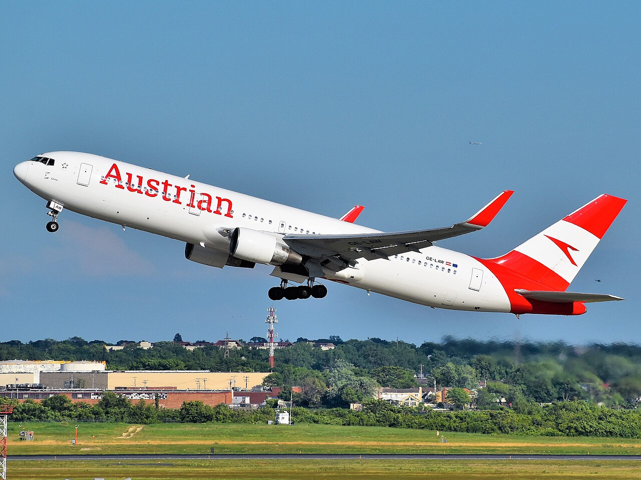 Austrian Airlines Boeing 767 taking off against a blue sky
