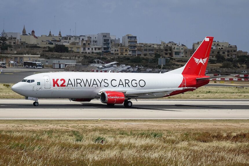 A K2 Airways Boeing 737-400F aircraft shown on its left-hand side