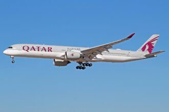 A Qatar Airways Airbus A350-1000 aircraft shown on its left-hand side