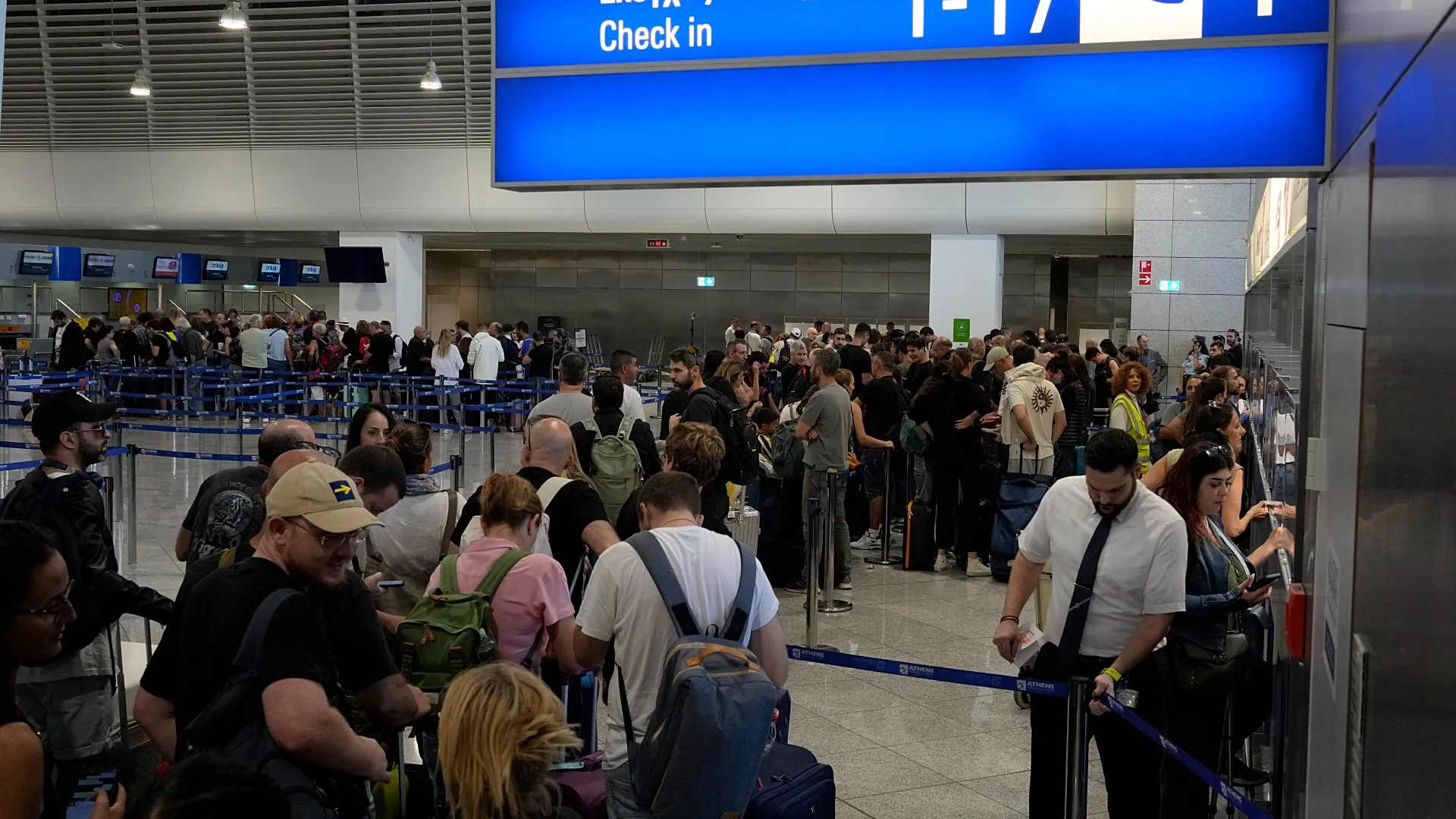 Large crowd of people at check in counters.