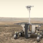 The Rosalind Franklin rover – a six-wheeled, white vehicle with a mast at the front holding cameras and sensors, here depicted on the Martian surface – set to launch to Mars in 2028, which is being built by Airbus Defence and Space, Stevenage, UK.