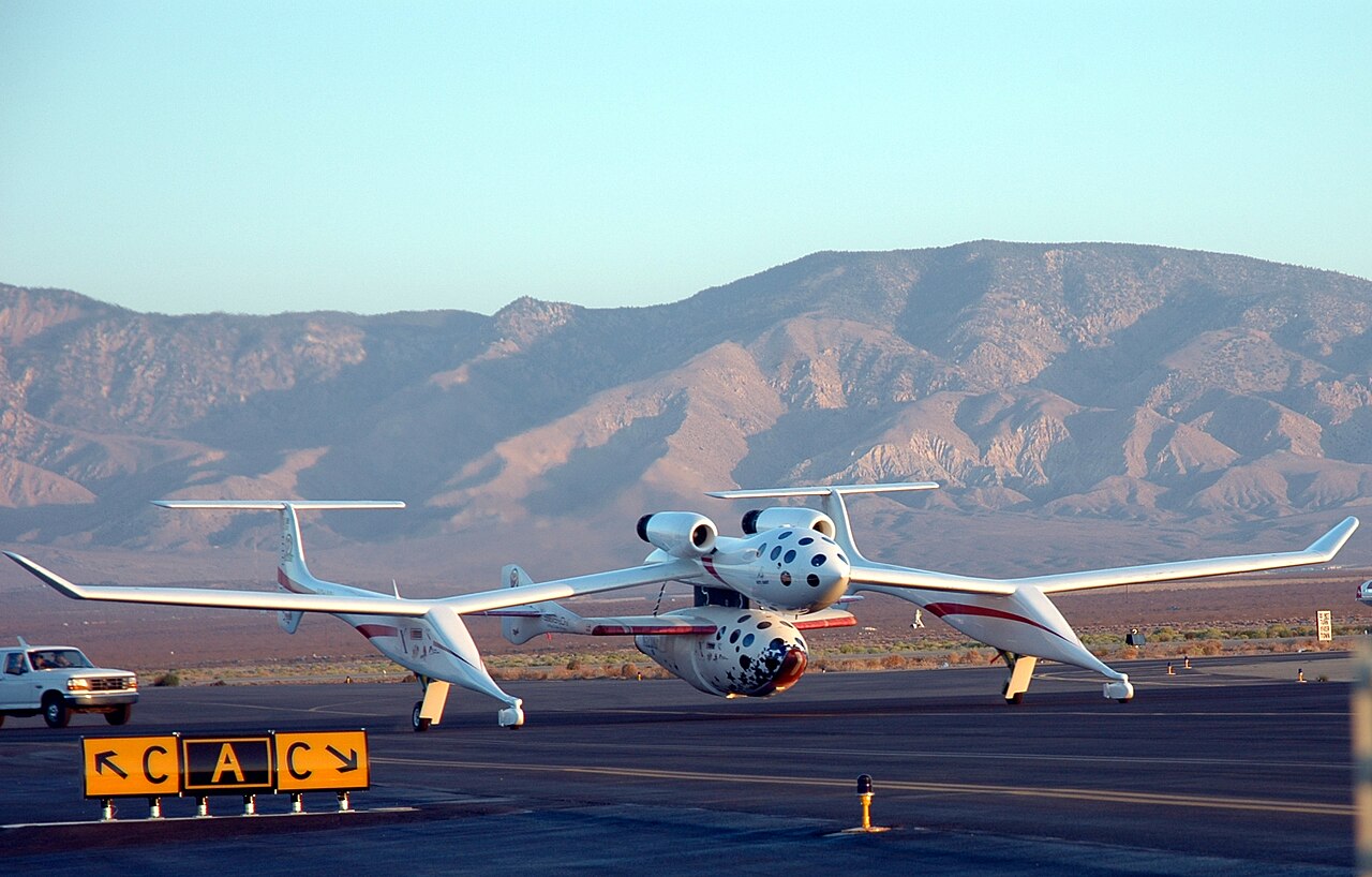 Another horizontal launch vehicle is Scaled Composite’s SpaceShipOne, a sleek white spacecraft shown here attached to its launcher aircraft named The White Knight.