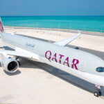 Photograph depicting the exterior of a Qatar Airways long-haul aircraft on the runway.