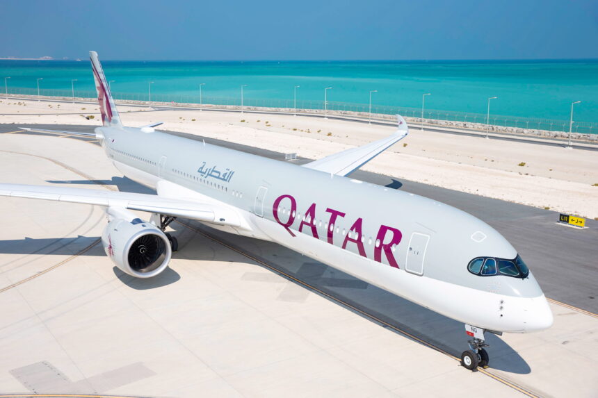 Photograph depicting the exterior of a Qatar Airways long-haul aircraft on the runway.