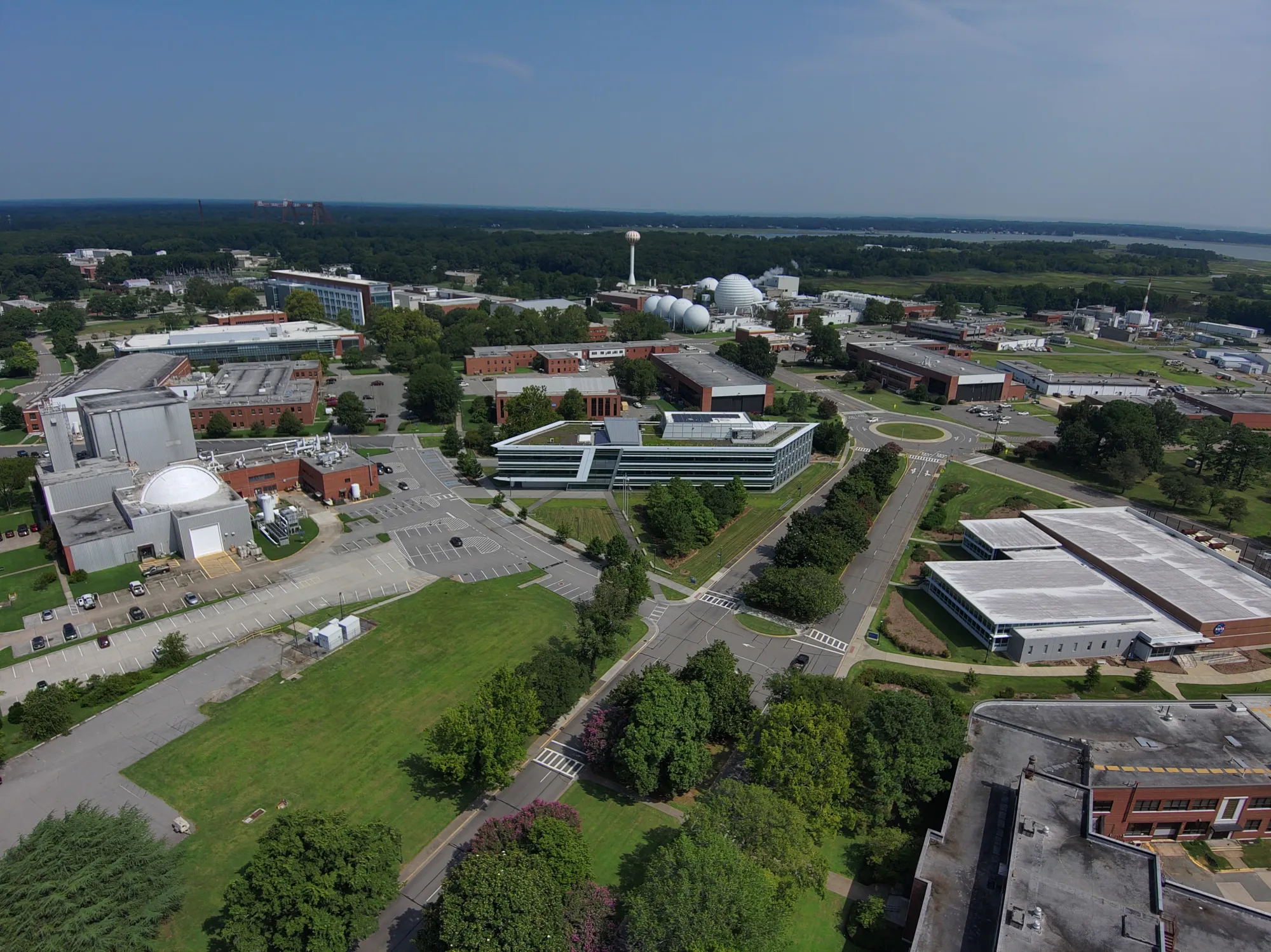 Buildings at NASA’s Langley Research Center, including the large Vacuum Spheres at the Hypersonic Facilities Complex, set among urban greenery.