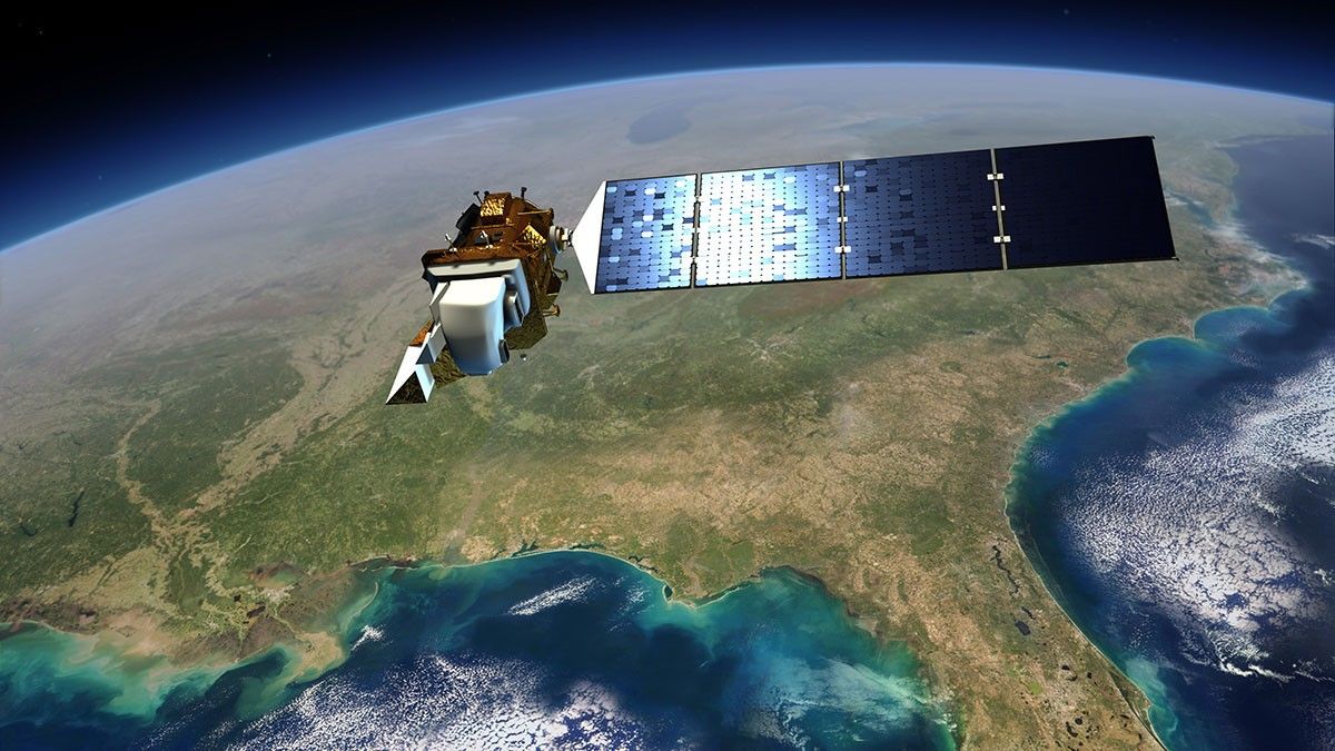 One of NASA's LandSat satellites, a gold and white cuboid with a large blue solar panel orbiting above the Earth, which has been used to observe crops from space.