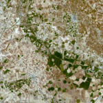 A patchwork of small green and brown shapes is in fact an image of fields and plains in central Spain as seen from above by the ESA-supported Deimos-1 satellite in Earth orbit.