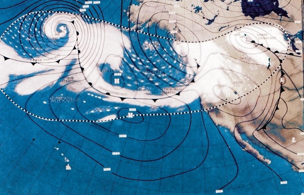 The first weather satellite was NASA's TIROS-1. The forecasting graphics obtained from orbital data, here seen as a crude map of the Western U.S. with images of clouds and isobars overlaid, have come on a lot since.