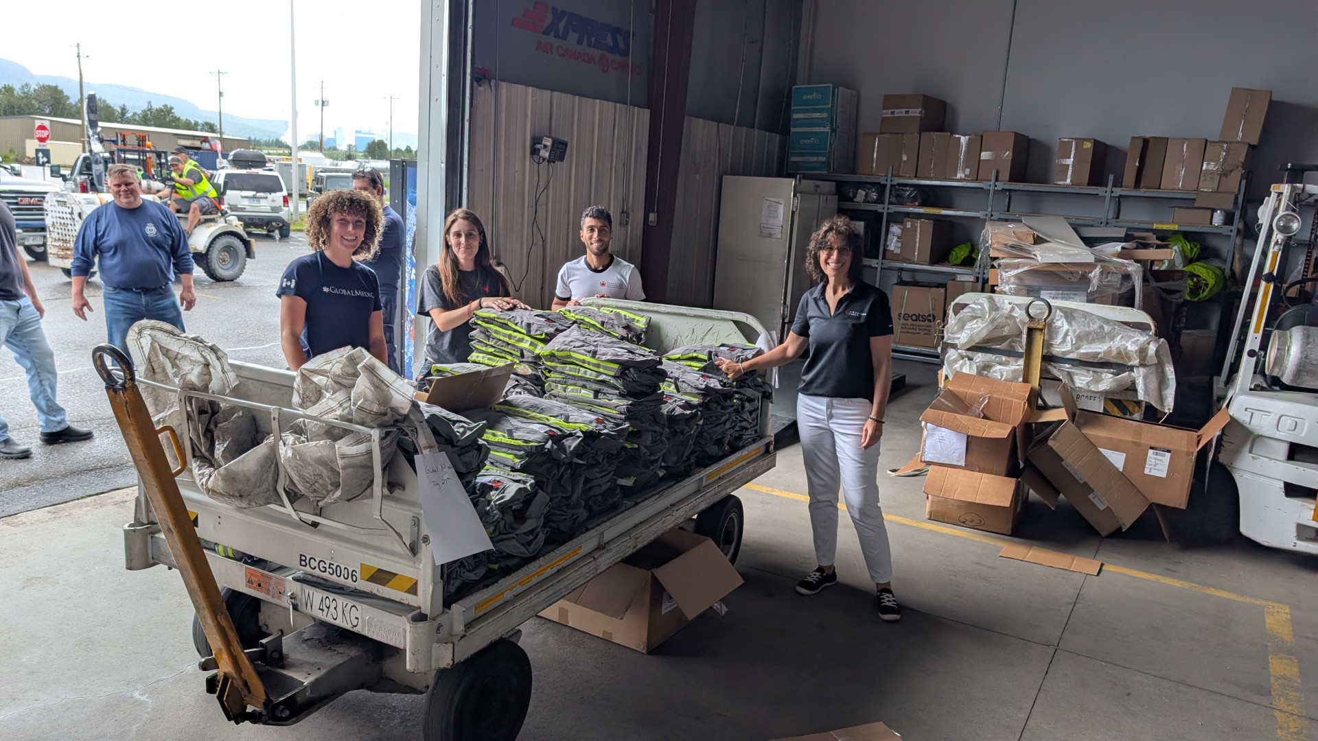 Volunteers take part in Air Canada relief efforts aimed at addressing the wildfires in Northern Ontario by distributing relief materials