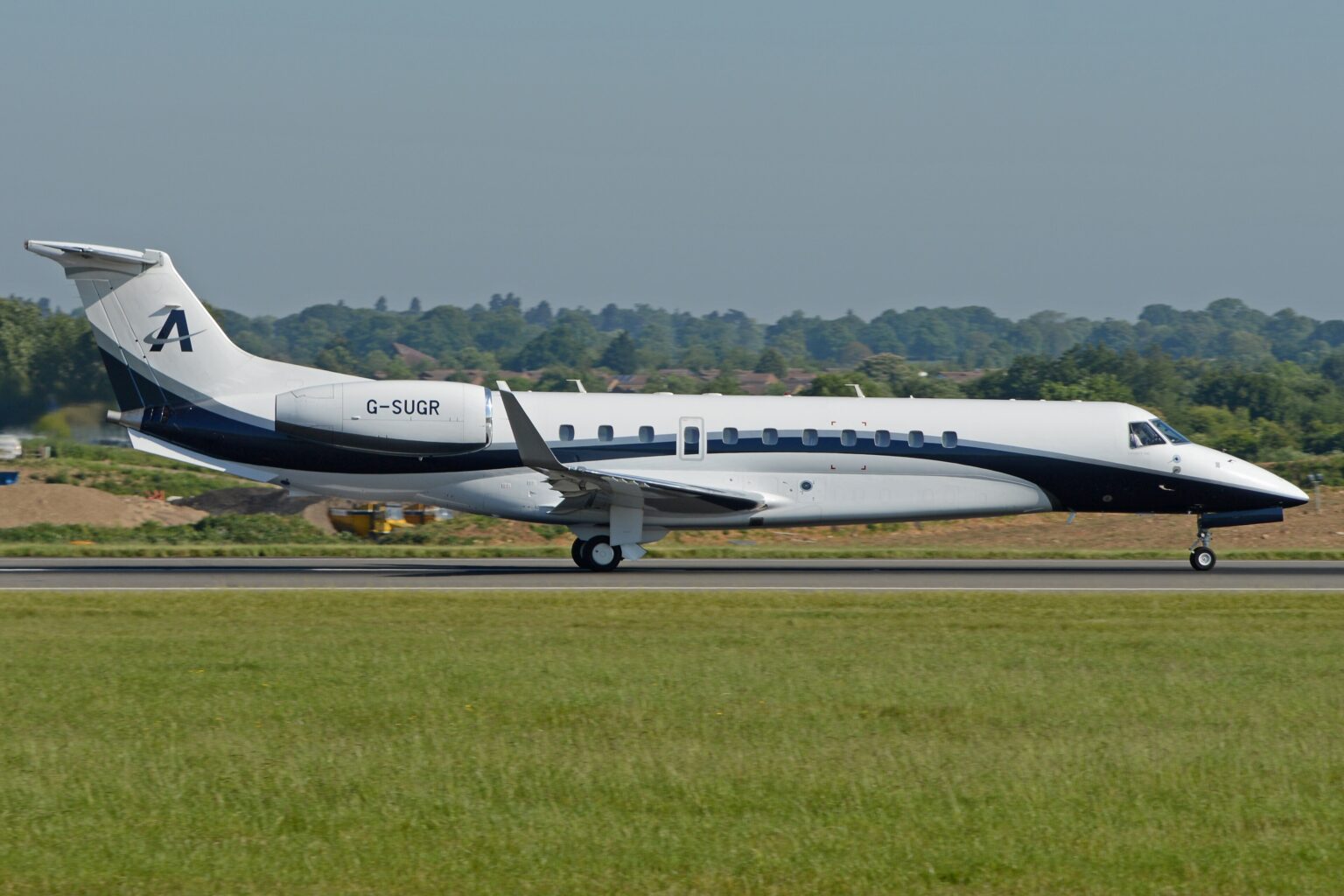 An Air Charter Scotland Embraer Legacy 650 aircraft shown on its right-hand side