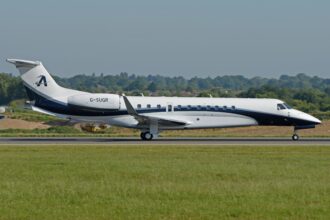 An Air Charter Scotland Embraer Legacy 650 aircraft shown on its right-hand side