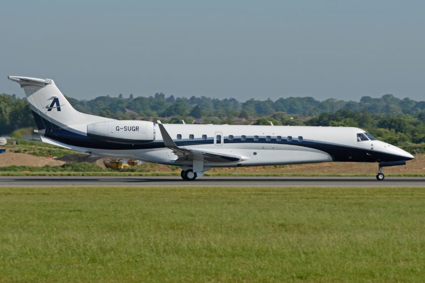 An Air Charter Scotland Embraer Legacy 650 aircraft shown on its right-hand side