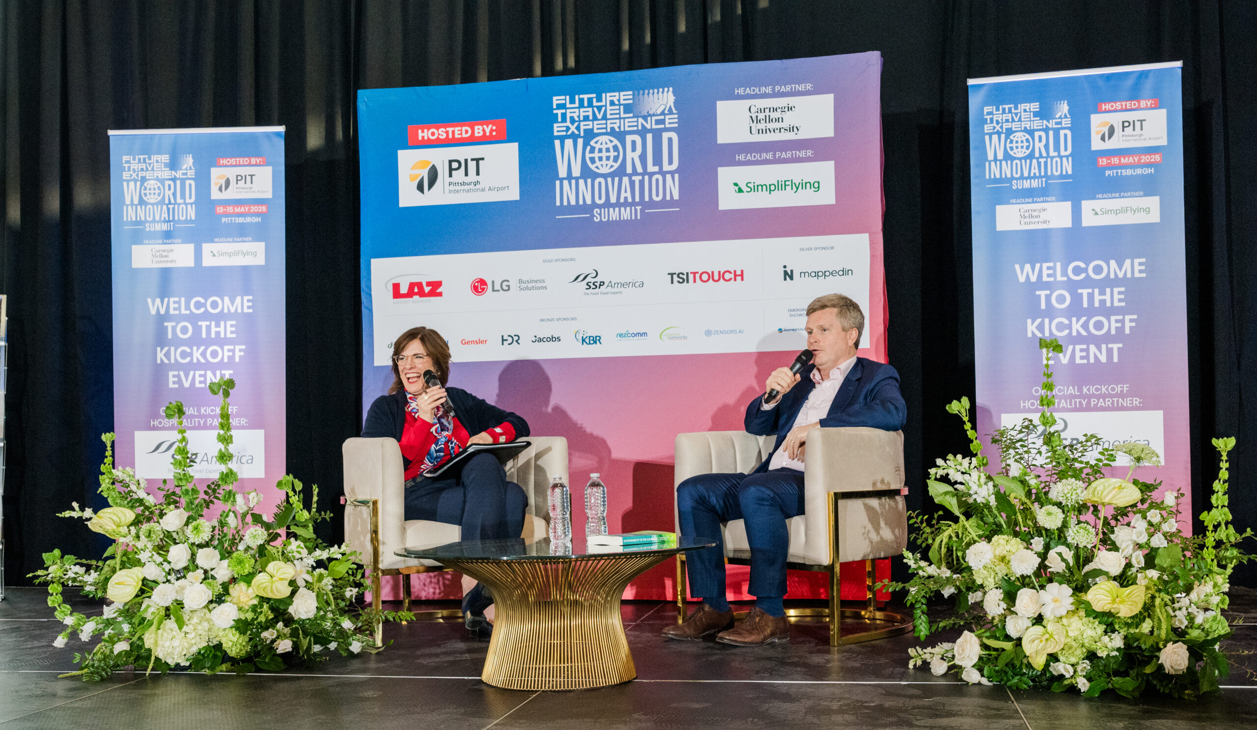 Christina Cassotis, PIT CEO and Sean Doyle British Airways CEO sat opposite each other talking into microphones to an audience surrounded by banners for FTE.