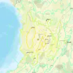 Map of western and central Colombia showing earthquake intensity zones overlaid on a terrain map. A yellow star marks the earthquake’s epicentre in the central-western part of the country, surrounded by irregular coloured contours indicating varying levels of shaking intensity. Concentric circular rings radiate outward from the epicentre, extending across the Pacific coast and inland regions. Major cities including Bogotá, Medellín, Cali and Pereira are labelled, along with rivers, roads and surrounding geographical features. The Pacific Ocean occupies the left side of the map, contrasting with the mountainous terrain and populated areas shown across Colombia.