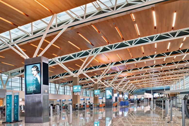 Decoustics custom wood Solo planks are providing the stunning ceiling highlight, utmost safety and superior acoustics to the newly opened International Terminal of Calgary Airport