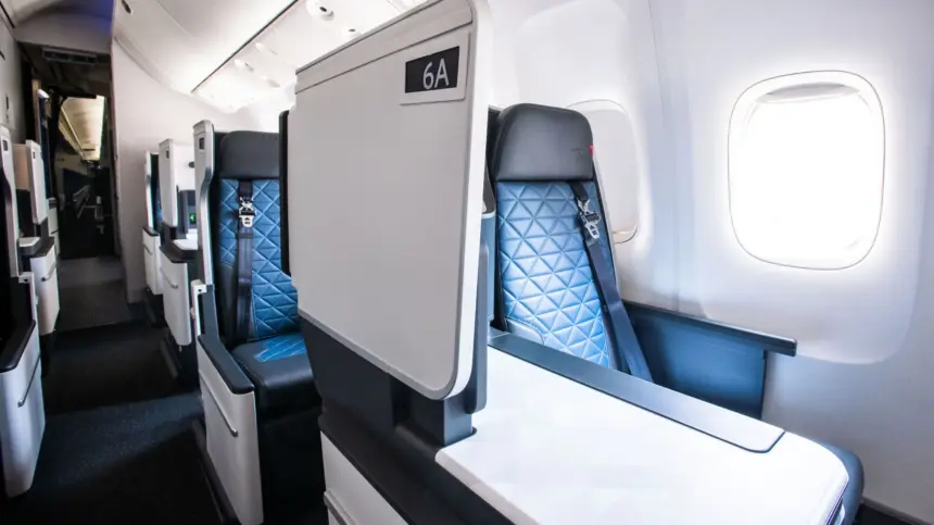 Inside a Delta aircraft, showing a Delta One suite seat.