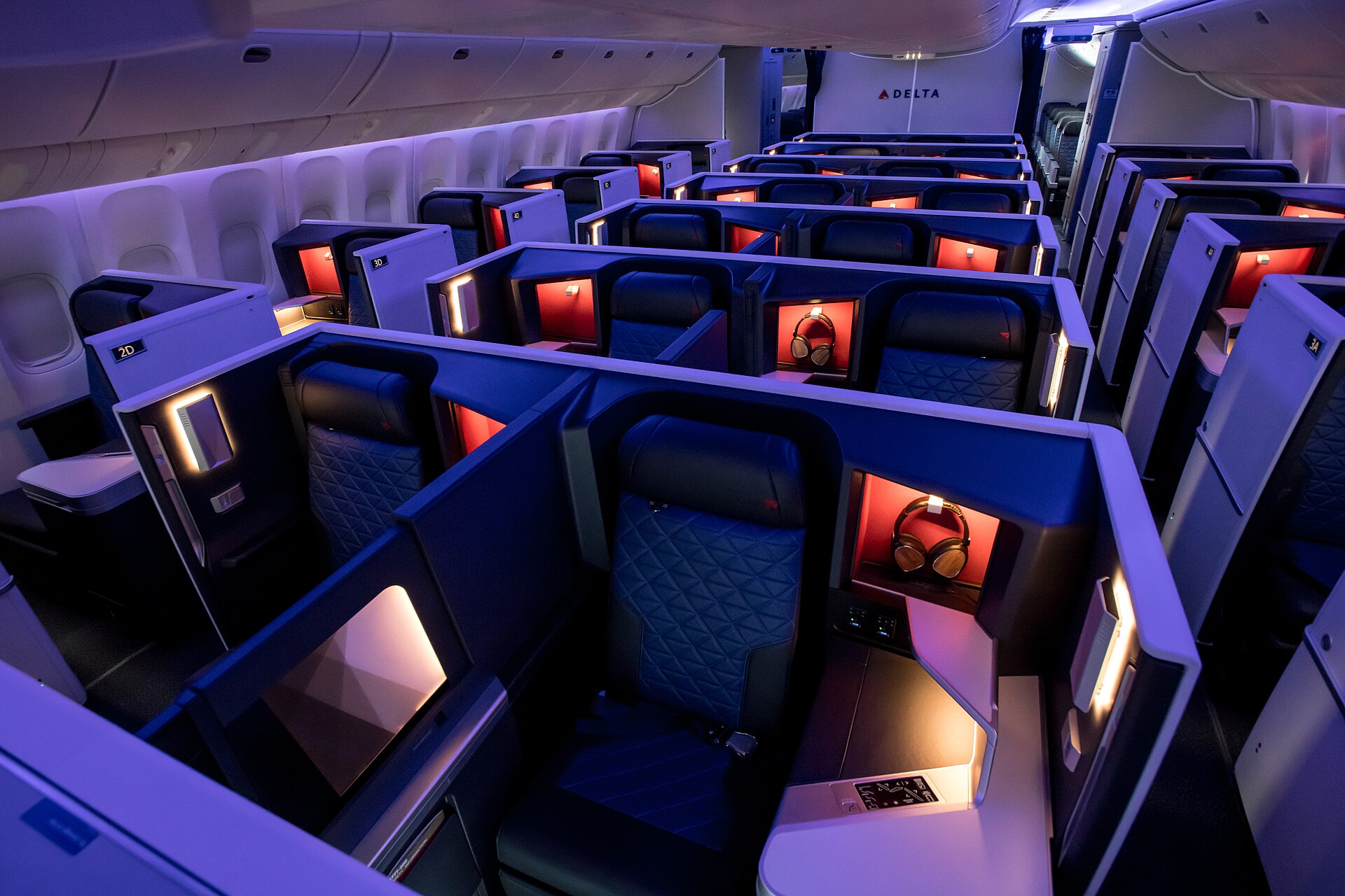Inside of a Delta aircraft, showing Delta One suite.