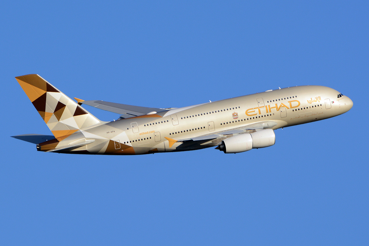 Full length side view of Etihad Airways Airbus A380 with its landing gear retracted.