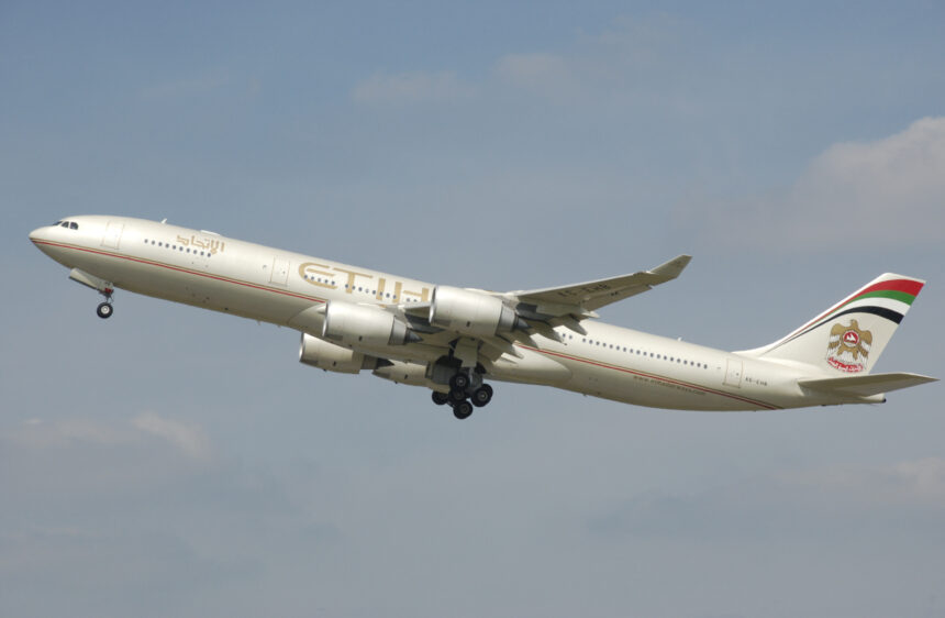 A now-retired Airbus A340-500 wearing the first livery with the old UAE coat of arms.