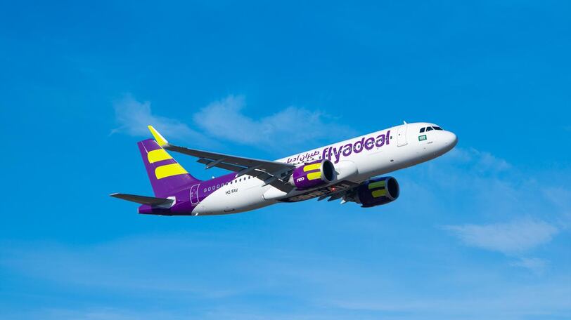 A Flyadeal aircraft shown on the right-hand side, featuring a clear blue sky background