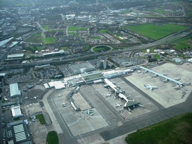 Aerial view of Glasgow Airport showing airplanes sitting behind each other