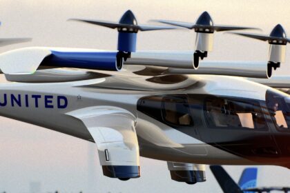 A blue and white Archer Midnight aircraft hovering above the ground in front of a sunset. It is painted in the livery of United Airlines.