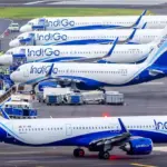 An image of 5 IndiGo planes parked at Mumbai Airport.