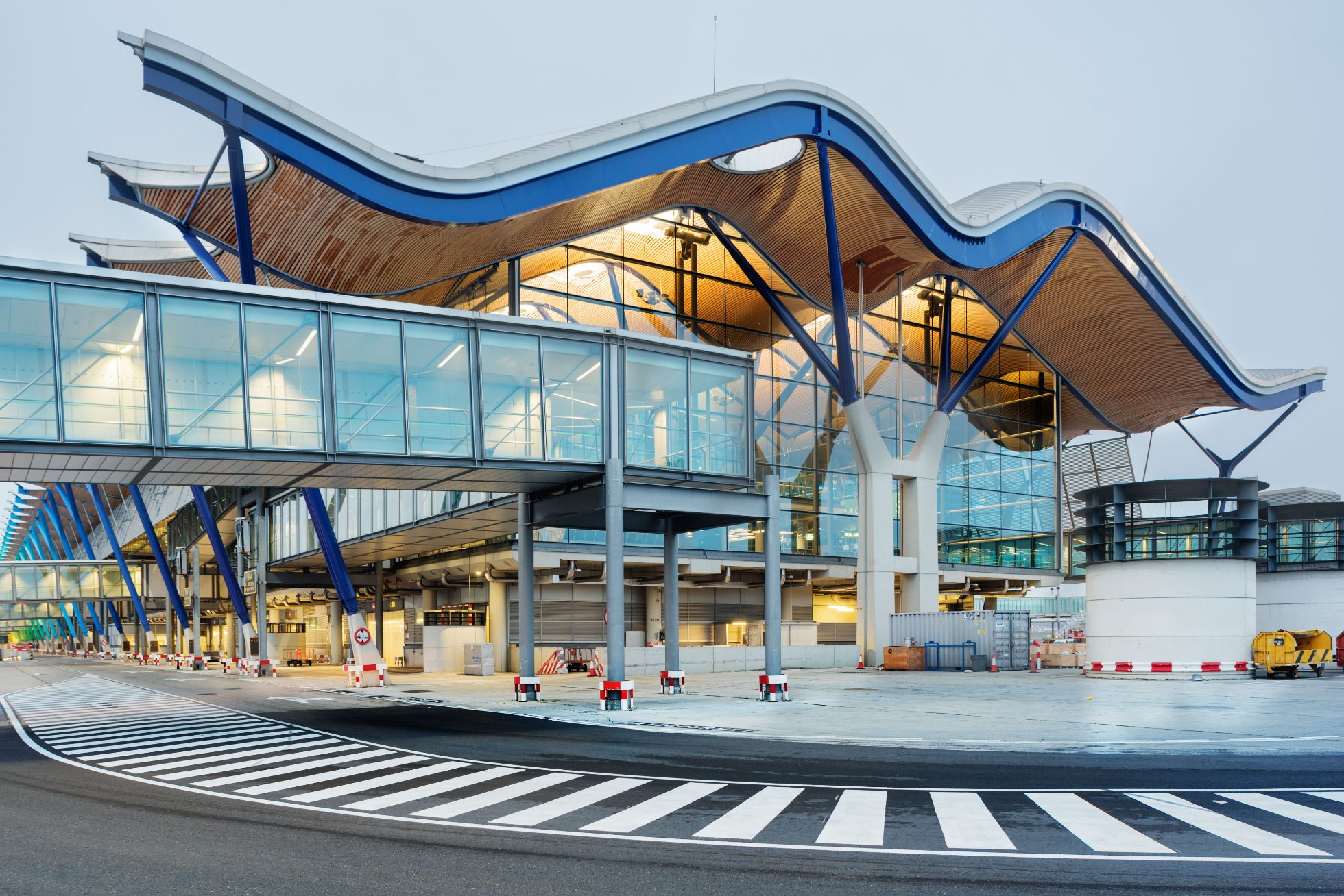 The glass-style façade of Madrid Barajas Airport showing one of its terminals 
