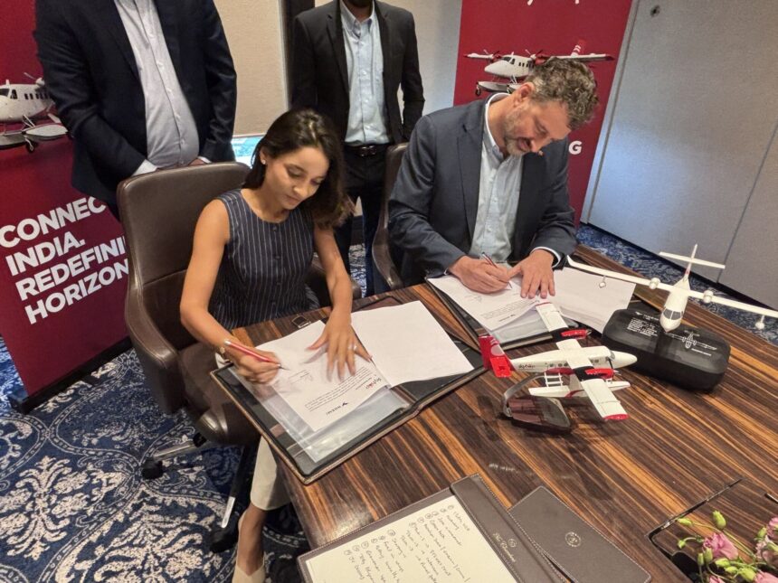 CEO's of Noemi Aerospace and SkyHop Aviation make sea plane deal. Both are sat down on a desk signing an agreement. They both look happy about the new achievement.