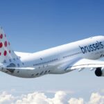 Brussels airlines Airbus A330 flying through the air above the clouds