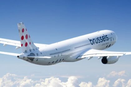 Brussels airlines Airbus A330 flying through the air above the clouds