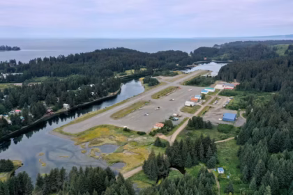 An aerial image of Seldovia Airport (SOV), which shows a short runway surrounded by water and forested land.